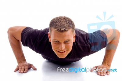 Smiling Male Doing Push Ups Stock Photo