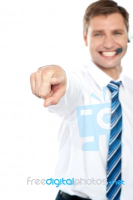 Smiling Male Executive Pointing Stock Photo