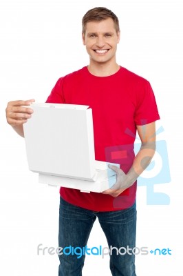 Smiling Male Holding Pizza Box Stock Photo