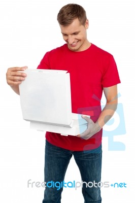 Smiling Male Holding Pizza Box Stock Photo