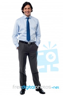 Smiling Male Manager Posing Casually Stock Photo