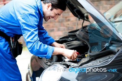 Smiling Male Mechanic At Work Stock Photo