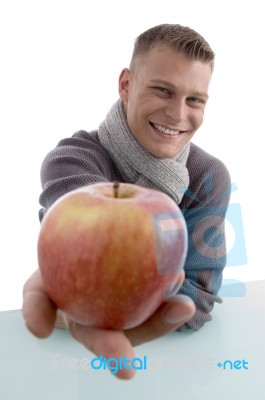 Smiling Male Showing Apple Stock Photo