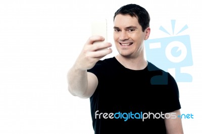 Smiling Man Clicking A Selfie Stock Photo