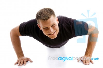 smiling Man Doing Push Ups Stock Photo