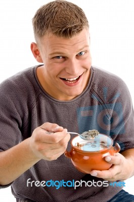 Smiling Man Eating Cornflakes Stock Photo