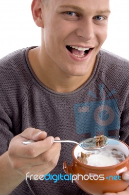 Smiling Man Eating Cornflakes Stock Photo