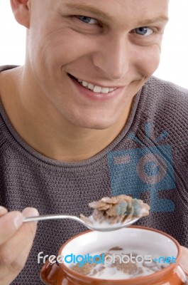 Smiling Man Eating Cornflakes Stock Photo