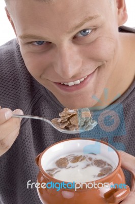 Smiling Man Eating Cornflakes Stock Photo