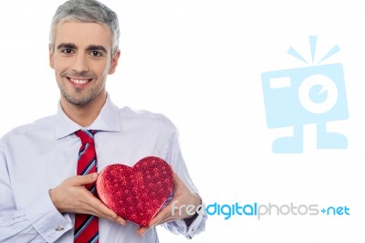 Smiling Man Holding A Gift Box Stock Photo