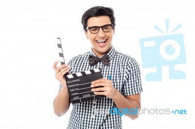 Smiling Man Holding A Movie Clap Stock Photo