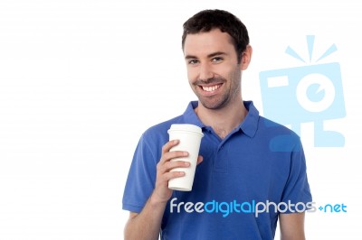 Smiling Man Holding Cold Beverage Stock Photo