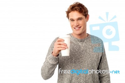 Smiling Man Holding Cold Beverage Stock Photo