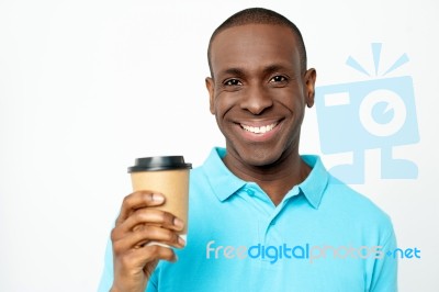 Smiling Man Holding Cold Beverage Stock Photo