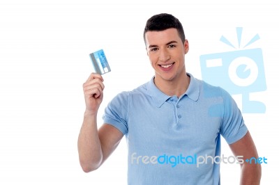 Smiling Man Holding Credit Card Stock Photo