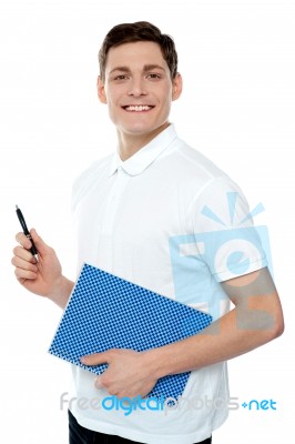 Smiling Man Holding Notebook Stock Photo