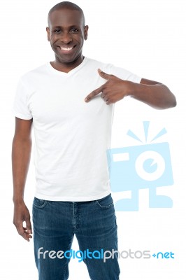 Smiling Man Pointing At Blank White T-shirt Stock Photo