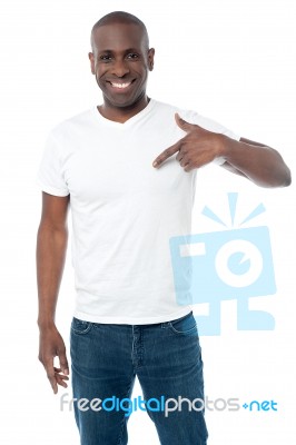 Smiling Man Pointing At Blank White T-shirt Stock Photo