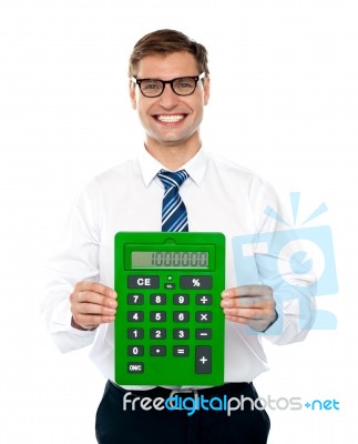  Smiling Man Showing Calculator Stock Photo