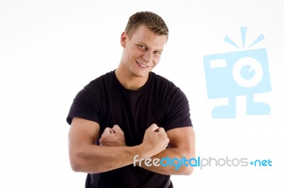 Smiling Man Showing His Muscles Stock Photo