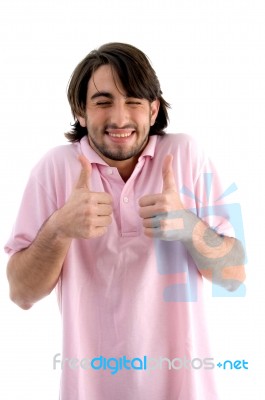 Smiling Man Showing Thumb Up Stock Photo