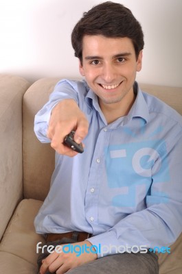 Smiling Man Watching Tv Stock Photo