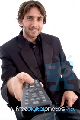 Smiling Man With Remote Control Stock Photo