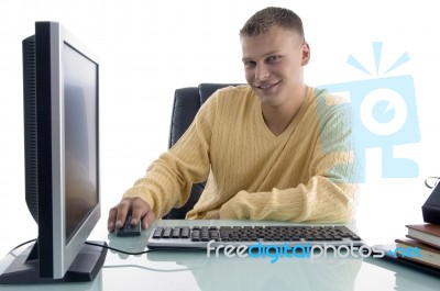 Smiling Man Working On Computer Stock Photo