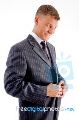 Smiling Manager Buttoning Jacket Stock Photo