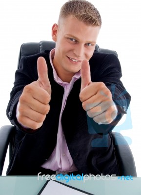 Smiling Manager Shows Approval Sign Stock Photo