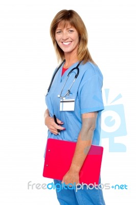 Smiling Medical Nurse With Clipboard Stock Photo