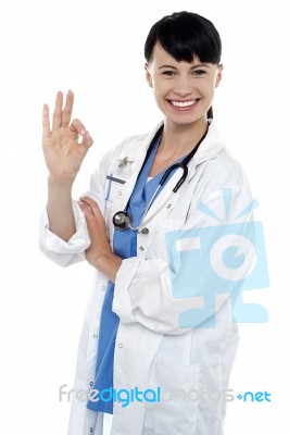 Smiling Medical Practitioner Showing Perfect Sign Stock Photo