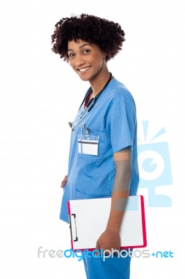 Smiling Medical Professional Holding Blank Clipboard Stock Photo