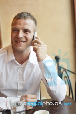 Smiling Men Speaking On Smartphone Stock Photo