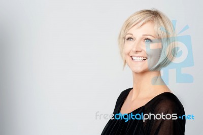 Smiling Middle Aged Lady Looking Upwards Stock Photo