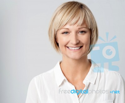 Smiling Middle Aged Lady, Studio Shot Stock Photo