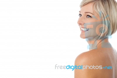 Smiling Nude Woman Looking Away Stock Photo