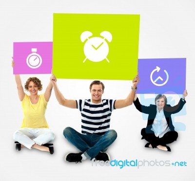 Smiling People Holding Board In Clock Symbol Stock Photo