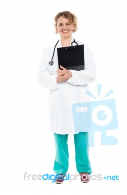 Smiling Physician With Clipboard And Stethoscope Stock Photo