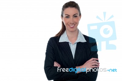 Smiling Professional Lady Posing With Arms Crossed Stock Photo