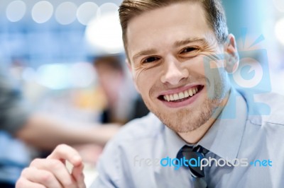 Smiling Relaxed Young Man In Restaurant Stock Photo