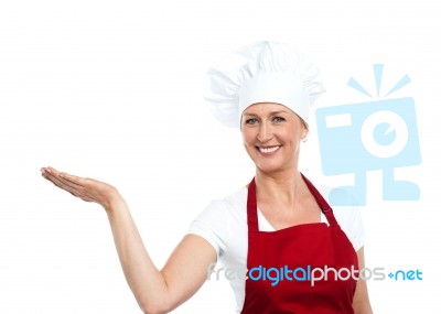 Smiling Senior Chef Showing Gesture Stock Photo