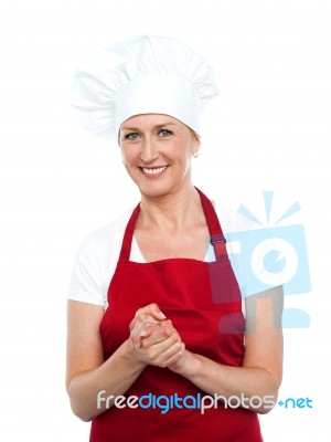 Smiling Senior Chef Standing Stock Photo