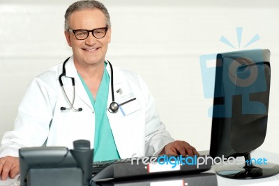 Smiling Senior Doctor Stock Photo