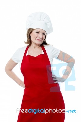 Smiling Senior Woman Chef, Isolated Over White Stock Photo