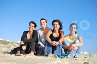 Smiling Sisters At The Beach Stock Photo