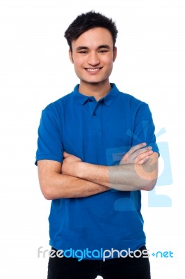 Smiling Smart Guy Posing With Confidence Stock Photo