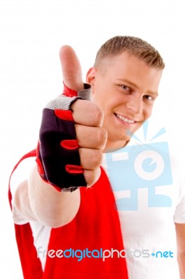 Smiling Spotive Male With Thumbs Up Stock Photo