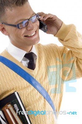 Smiling Student Talking Over Mobile Stock Photo