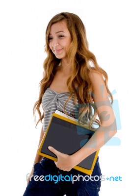 Smiling Teenage Girl Holding Books Stock Photo